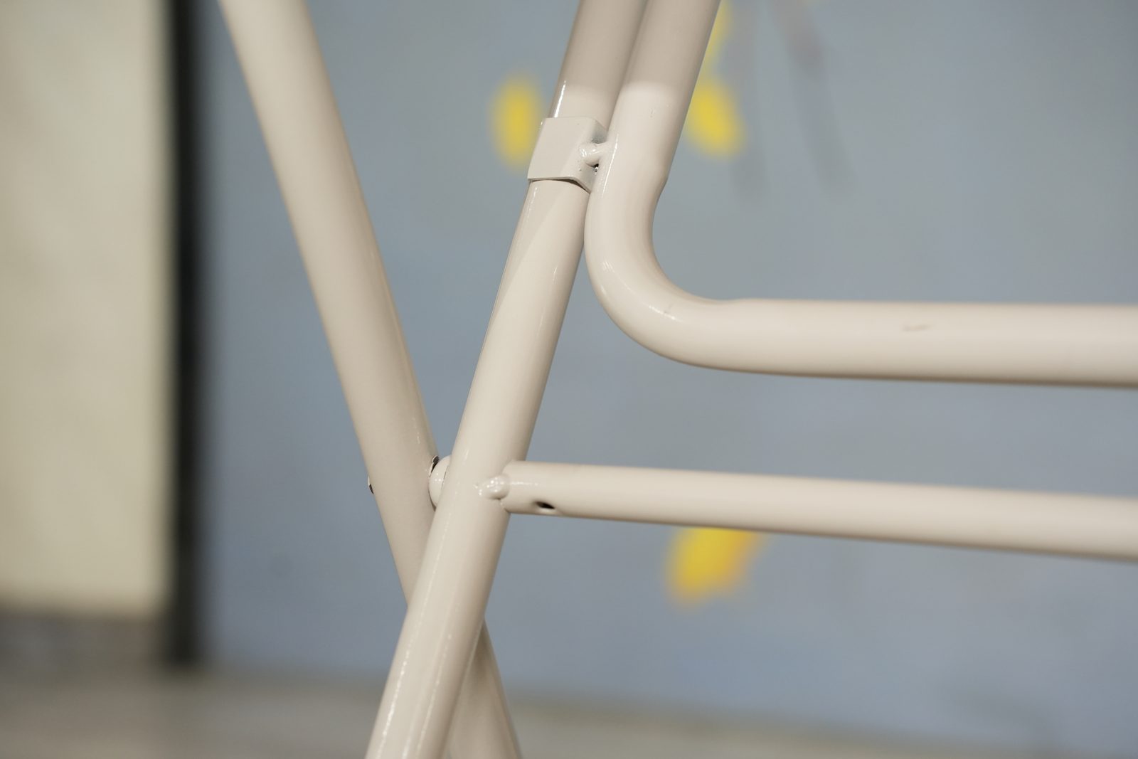 Welded white steel folding legs