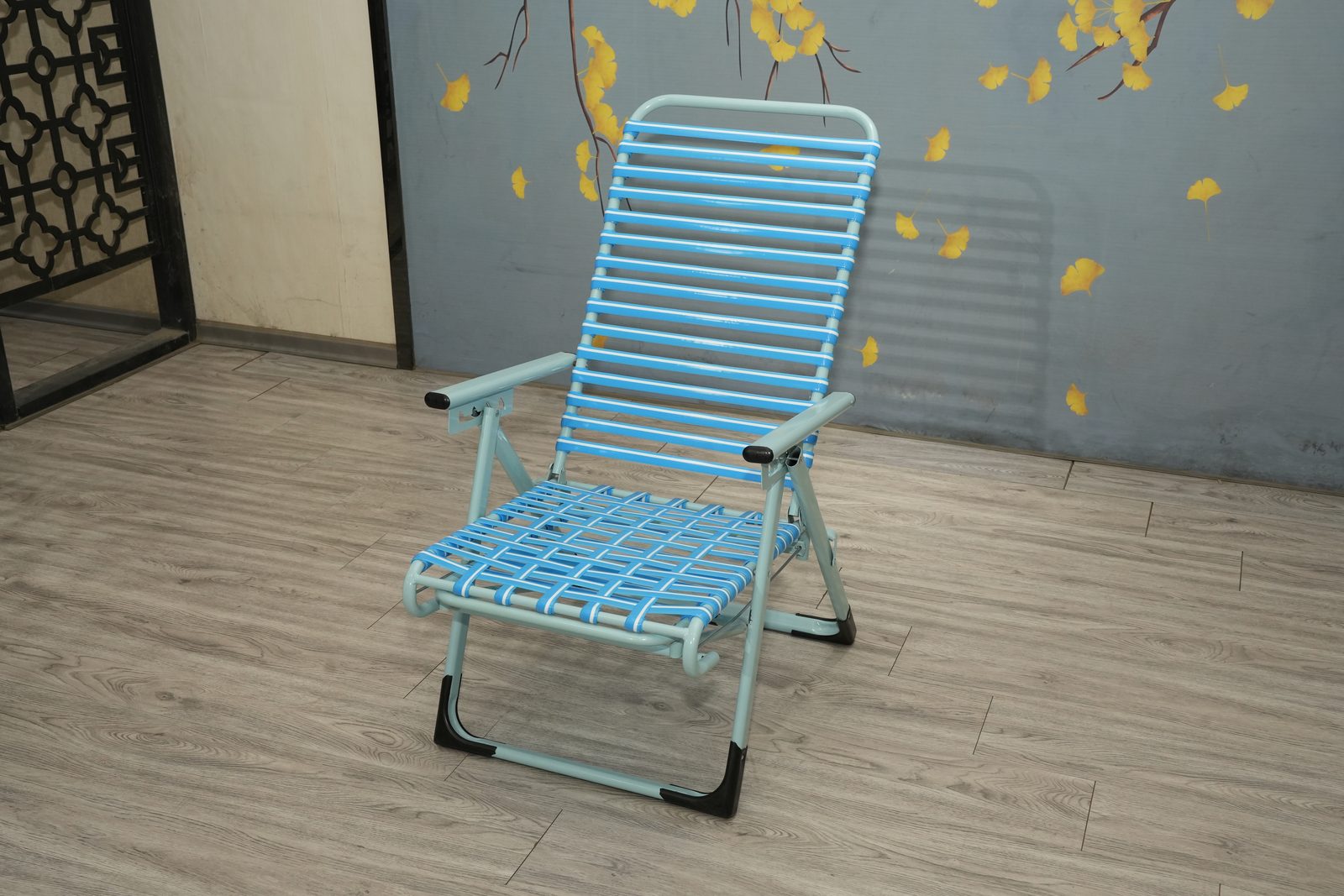 Light blue steel folding recliner with blue striped straps